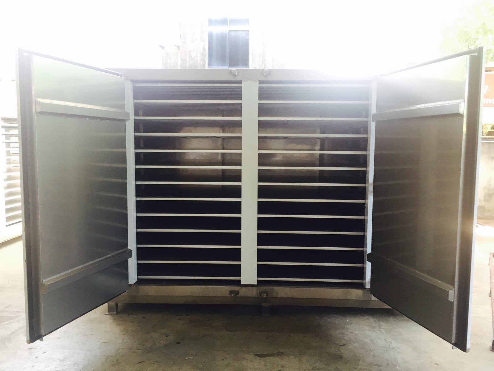 Semi-contact plate freezer with both swing doors open, showing the aluminium plate tiers